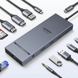 UGREEN USB-C Hub with 4K Video Ethernet and 10Gbps Data surrounded by various cables and connectors.