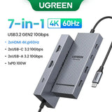 UGREEN USB-C Hub with 4K Video Ethernet and 10Gbps Data surrounded by various cables and connectors.