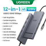 UGREEN USB-C Hub with 4K Video Ethernet and 10Gbps Data surrounded by various cables and connectors.
